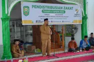 Serahkan Zakat Rp244 Juta, Wabup Siak Dorong Mustahik Pusako Naik Kelas Jadi Muzaki