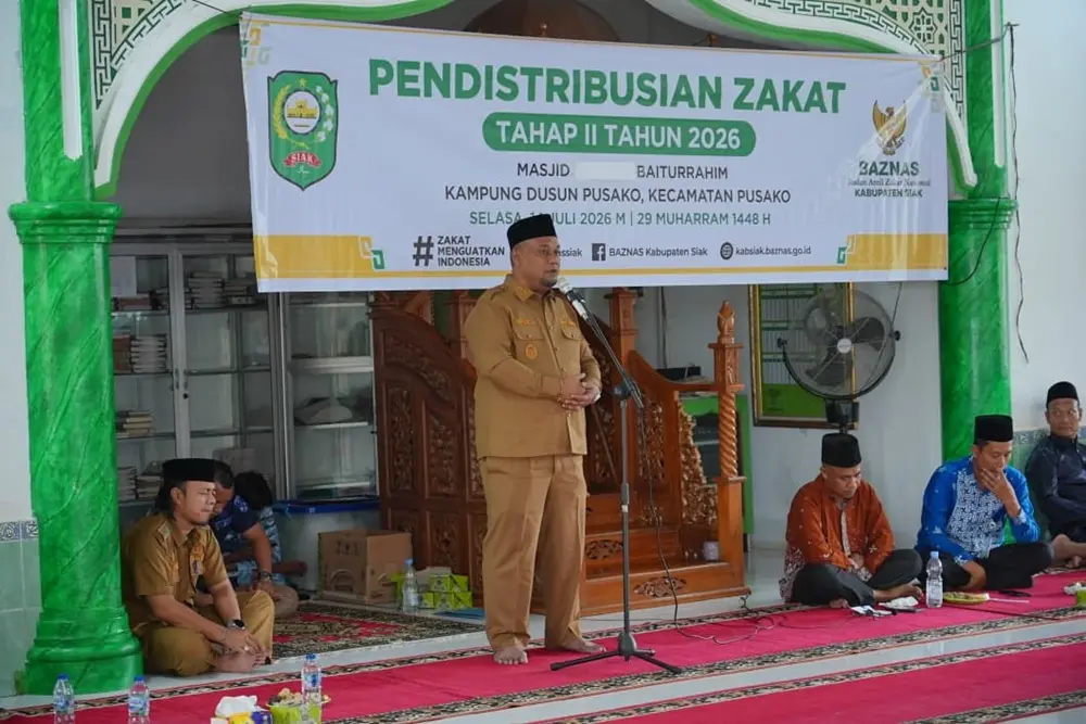 Serahkan Zakat Rp244 Juta, Wabup Siak Dorong Mustahik Pusako Naik Kelas Jadi Muzaki